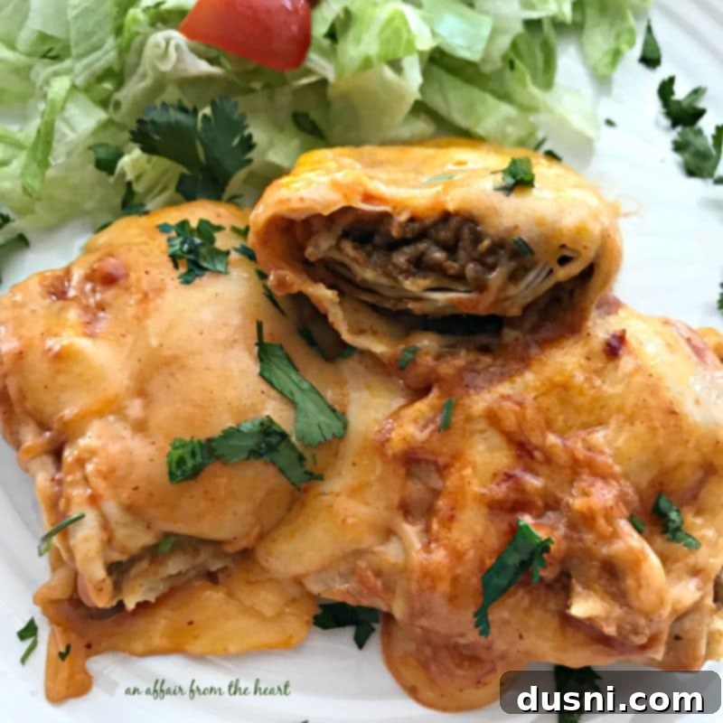 Comforting Slow Cooker Smothered Burritos 16 Slow Cooker Smothered Burritos in a pan, ready for serving.