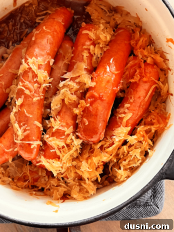 BBQ Hot Dogs and Sauerkraut 12 A dish of BBQ Hot Dogs with Sauerkraut, perfectly cooked and ready to serve.