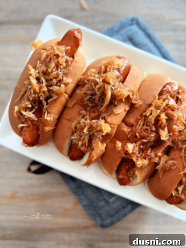 BBQ Hot Dogs and Sauerkraut 3 A close-up of a BBQ hot dog with sweet and smoky sauerkraut.