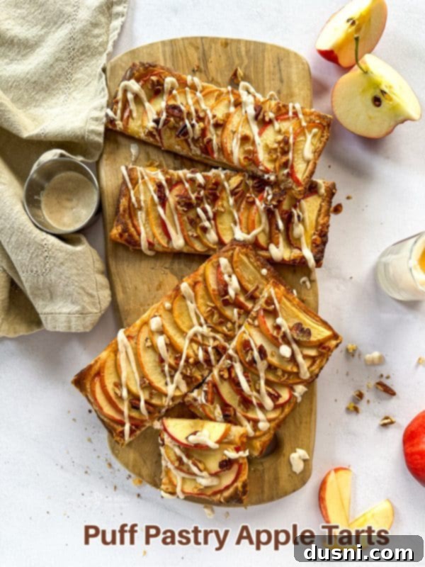 Simple Puff Pastry Apple Tarts 15 Hero shot of Puff Pastry Apple Tarts with a dusting of powdered sugar