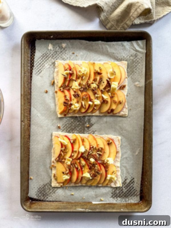 Simple Puff Pastry Apple Tarts 9 Spreading cream cheese on puff pastry
