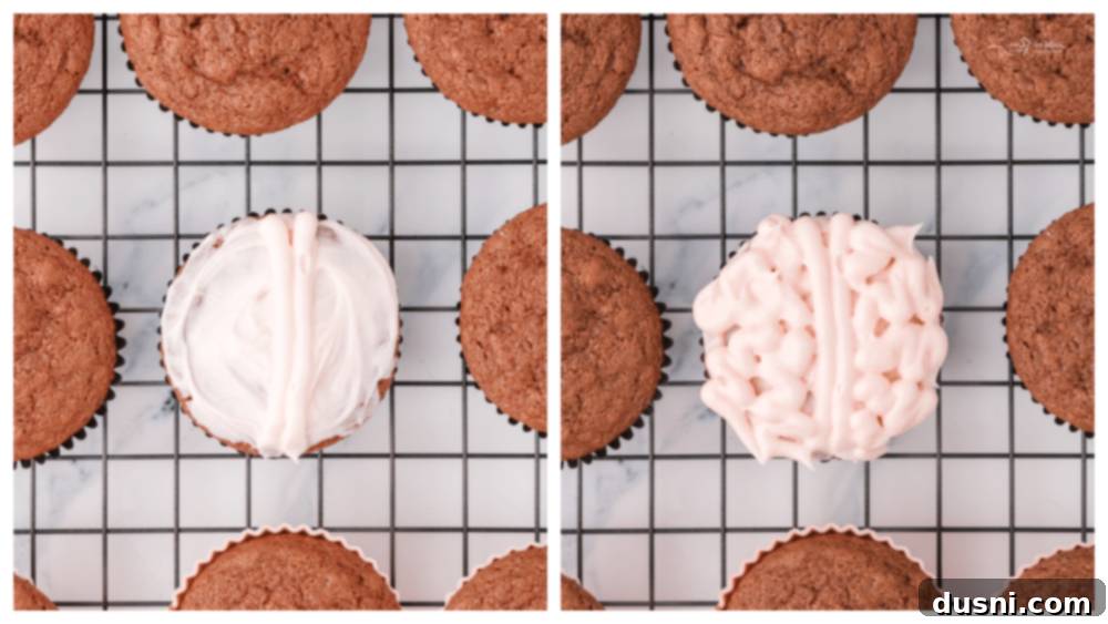 Ghoulish Grey Matter Cupcakes 15 A visual step-by-step image showing cooled cupcakes waiting to be frosted, with piping bags and a bowl of frosting in the background, signaling the next stage of decoration.