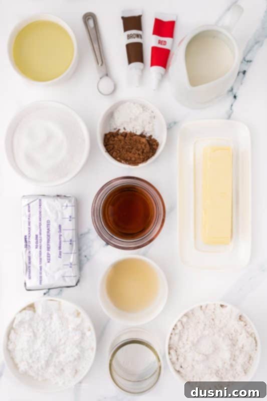 Ghoulish Grey Matter Cupcakes 5 An overhead shot of two Halloween Brain Cupcakes on a rustic dark surface. The vibrant pink 'brain' frosting and the deep red 'blood' create a striking contrast, making them an eye-catching and unsettlingly beautiful Halloween dessert.