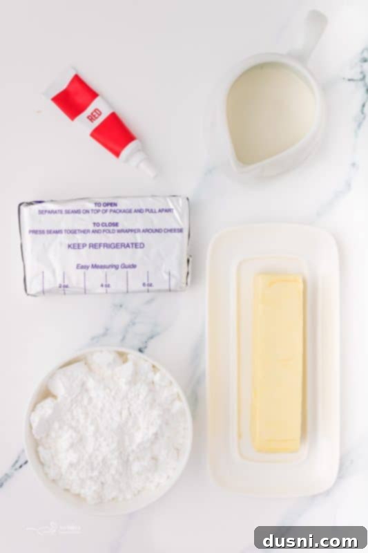 Ghoulish Grey Matter Cupcakes 7 A close-up of a bowl filled with creamy, pink-tinted cream cheese frosting, ready to be used for decorating the Halloween Brain Cupcakes. The smooth texture and vibrant color promise a delicious and visually appealing topping.