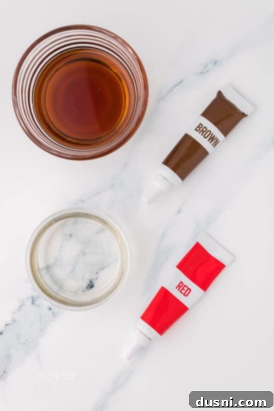 Ghoulish Grey Matter Cupcakes 8 A small glass bowl containing the dark red, viscous edible blood, with a medicine dropper nearby. This image highlights the final touch for the Halloween Brain Cupcakes, emphasizing the realistic and spooky effect.