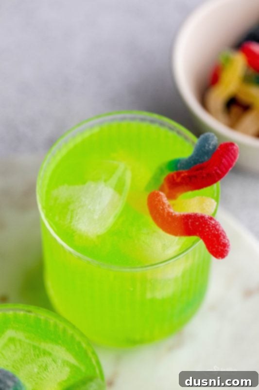 Closeup of Green Kids Halloween Punch with Sour Worms