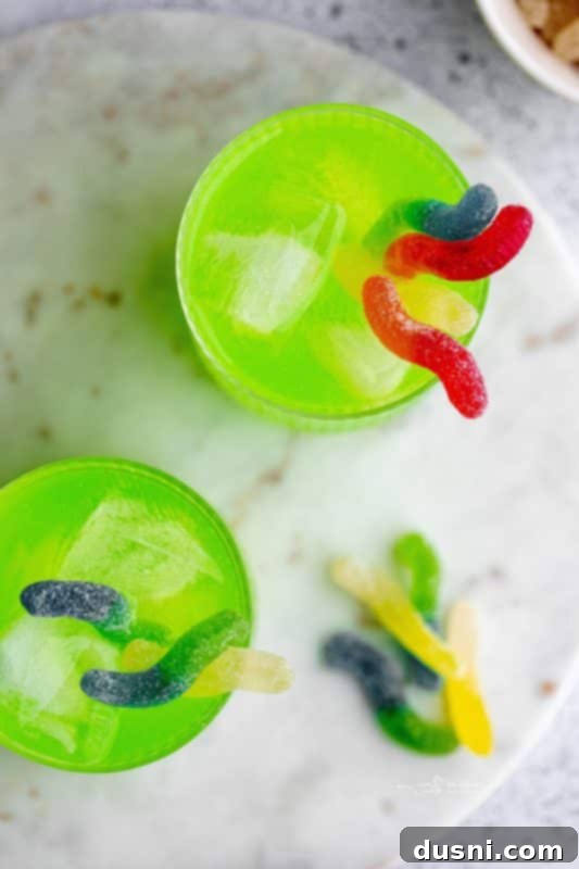 Halloween Punch in a glass with gummy worms