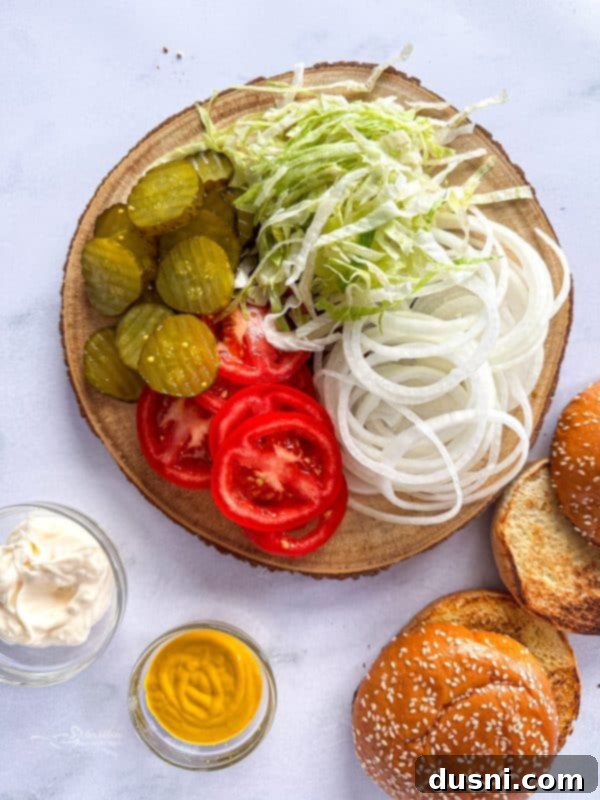 Tenderloin Crunchwich 13 Freshly fried breaded pork tenderloins resting on a wire rack to drain oil.
