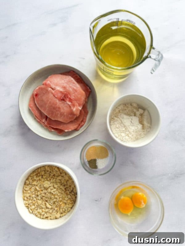 Tenderloin Crunchwich 5 A Breaded Pork Tenderloin Sandwich with generous toppings, ready to be served.