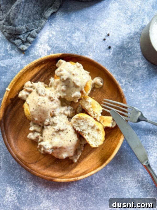 A delicious skillet of homemade sausage gravy, ready to be served over warm biscuits or other comfort foods.