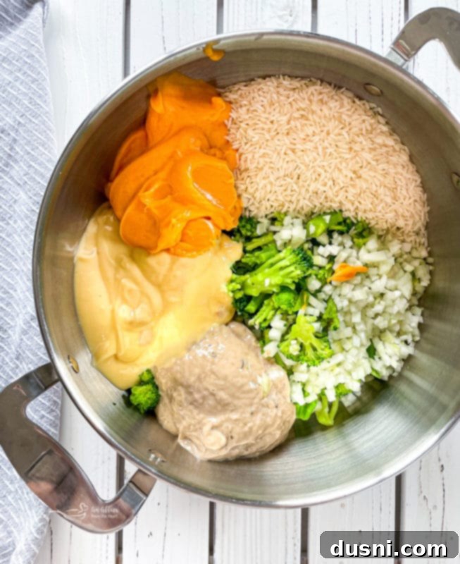 Broccoli, onion, rice, cream of chicken and mushroom, and Cheese Whiz in a large pot