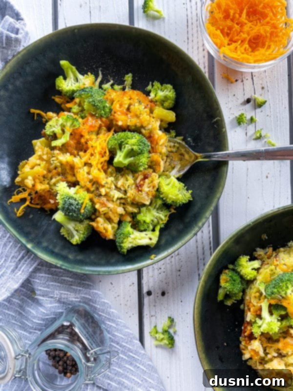 Two plates with broccoli and cheese casserole