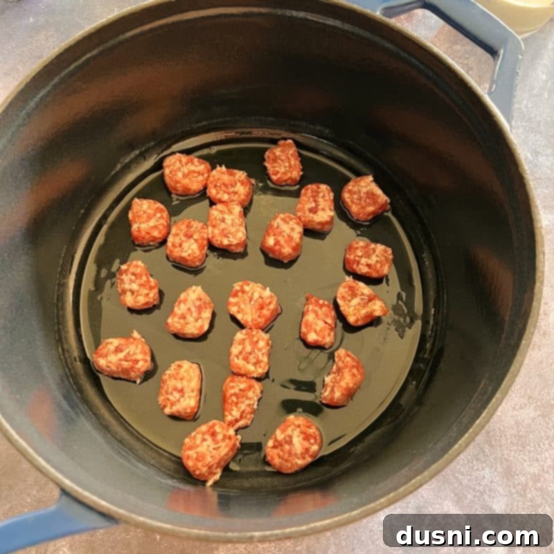 Alsatian Choucroute Soup 7 Slicing bratwurst for French Sauerkraut Soup.