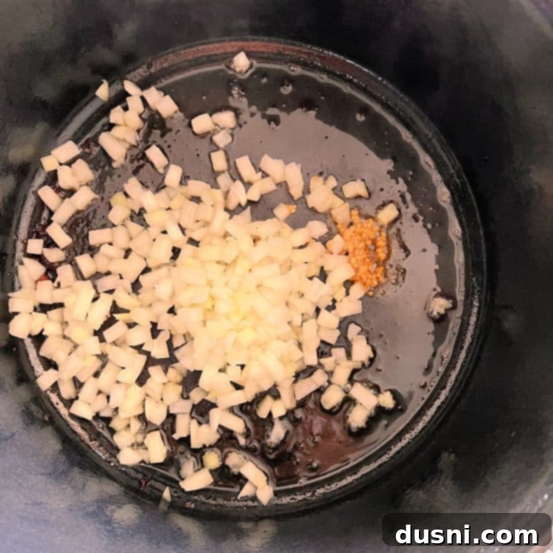 Alsatian Choucroute Soup 8 Sautéing onions and garlic in a soup pot.