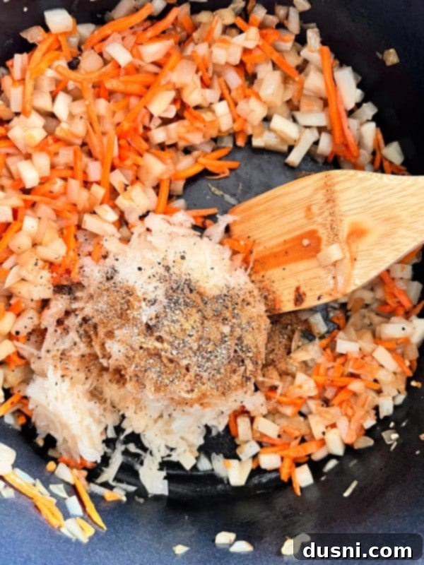Alsatian Choucroute Soup 10 Adding spices and sauerkraut to the soup pot.