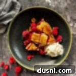 Sun-Kissed Raspberry Pie 19 Close up of a slice of raspberry pie and ice cream on a green plate