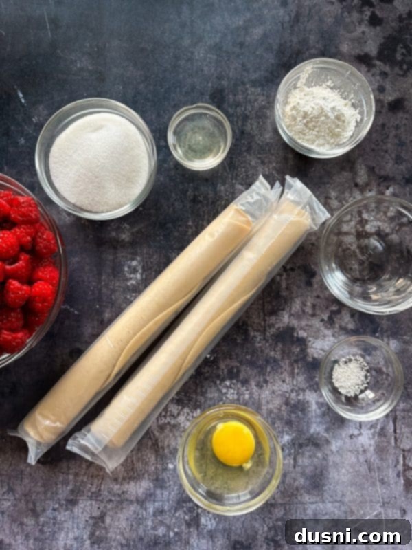 Sun-Kissed Raspberry Pie 5 Top-down view of a fresh raspberry pie filling being mixed with dry ingredients in a bowl