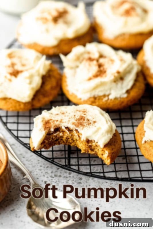 Hero shot of a plate of soft pumpkin cookies with frosting