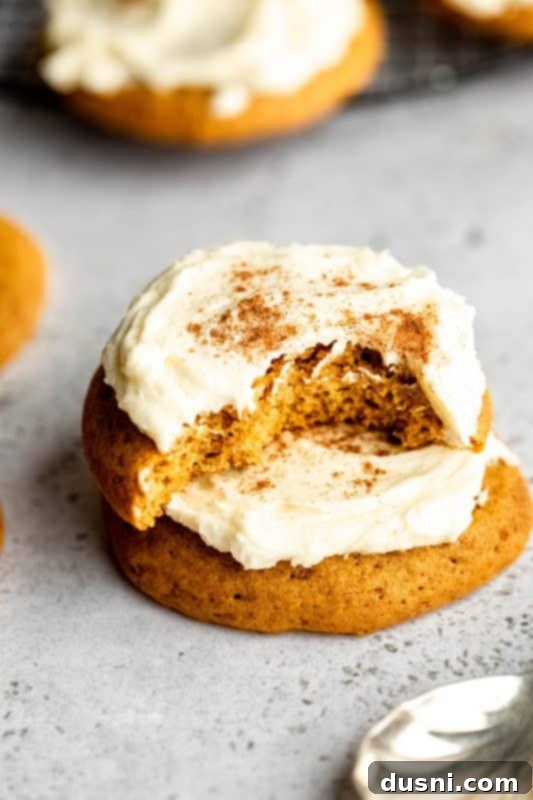 Stack of soft pumpkin cookies with frosting