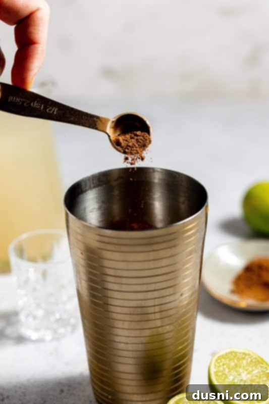 Step 4: Add pumpkin spice to the shaker.