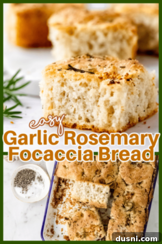 A large piece of homemade Garlic Rosemary Focaccia Bread on a wooden board