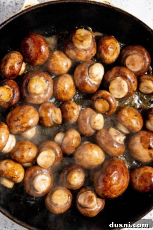 Velvety Bacon Mushroom Skillet 11 White wine added to sautéed mushrooms, reducing in the skillet