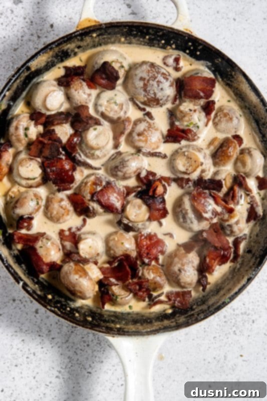 Velvety Bacon Mushroom Skillet 15 Bacon stirred into the creamy mushrooms, ready for cheese