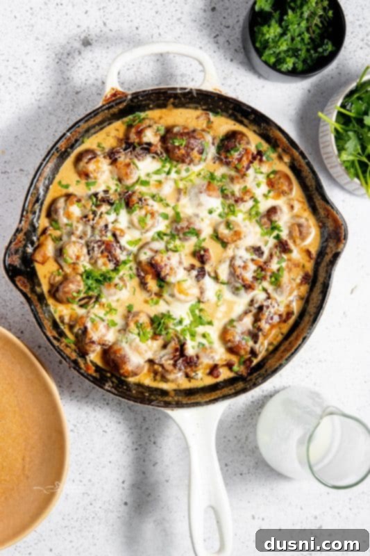 Velvety Bacon Mushroom Skillet 3 A vibrant close-up shot of the creamy mushrooms and bacon dish, ready to be served