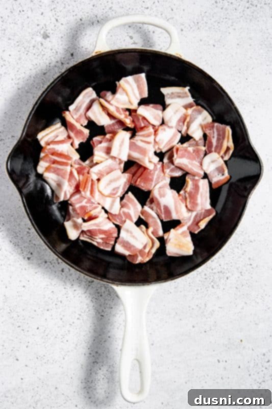 Velvety Bacon Mushroom Skillet 7 Bacon cubes sizzling in a large skillet