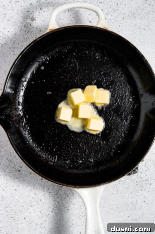 Velvety Bacon Mushroom Skillet 9 Butter melting in the skillet with bacon grease