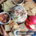 Overhead of Sauerkraut Bacon & Swiss Cheese Ball on a charcuterie board