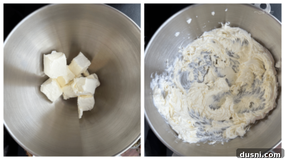 A mixing bowl with softened cream cheese, being whipped smooth with a mixer.