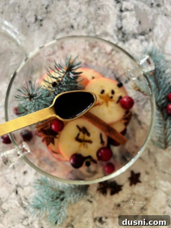 Adding nutmeg to the simmer pot ingredients.