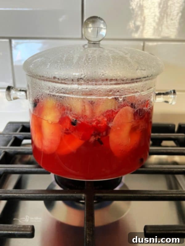 The simmer pot gently bubbling on the stove.