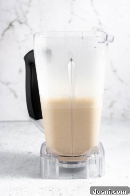 Homemade Blender Eggnog 13 Blender lid on, ready for the final quick blend of all eggnog ingredients.