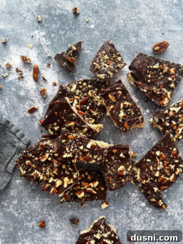 Classic Handcrafted Toffee 6 Bowl of chocolate chips and scattered pecans, ready for toffee topping.