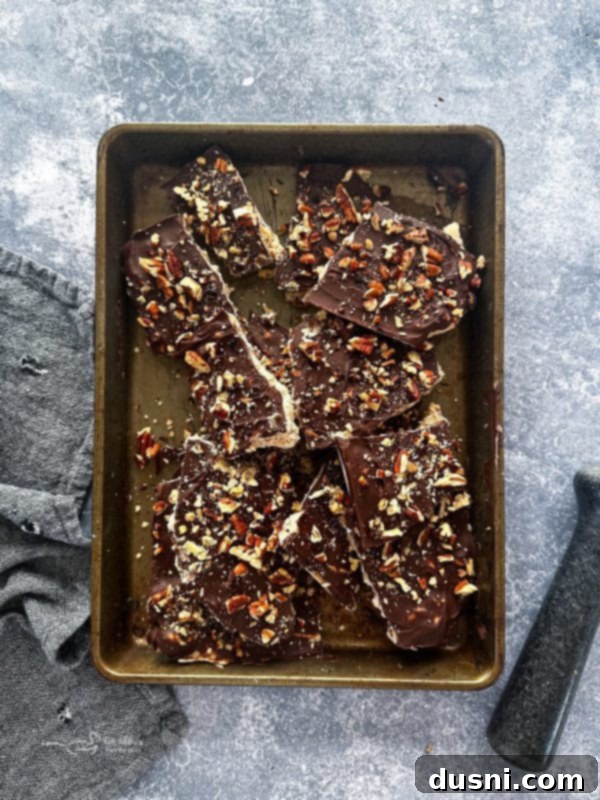 Classic Handcrafted Toffee 9 Smooth layer of melted chocolate over toffee in a pan.