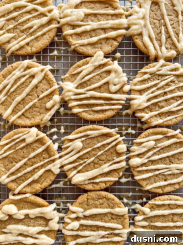 Close-up of Iced Maple Sugar Cookies on a cooling rack, showcasing their soft texture and maple glaze