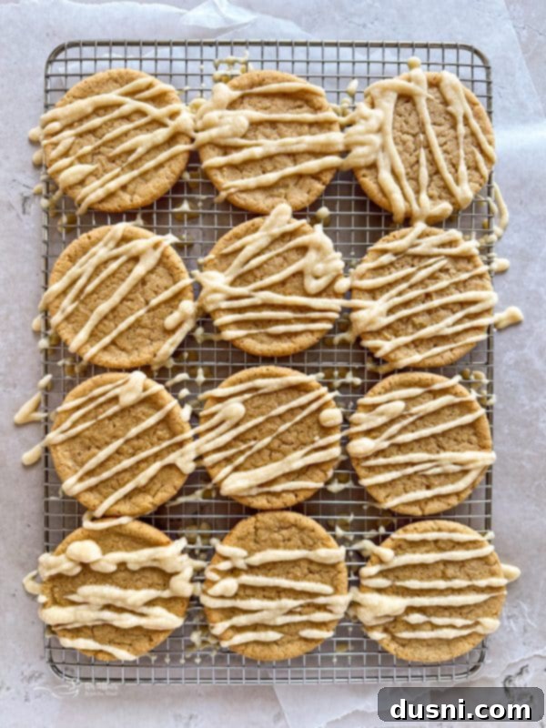 A bowl of maple icing with a whisk, ready for glazing