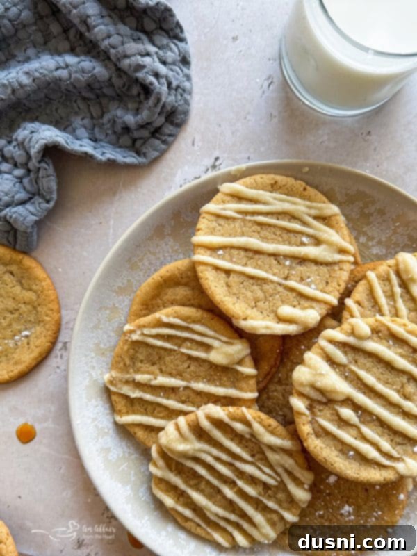 Close-up of three Iced Maple Sugar Cookies with a bite taken out of one