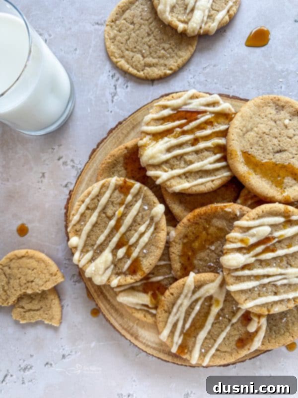 Pile of Iced Maple Sugar Cookies stacked on a white plate
