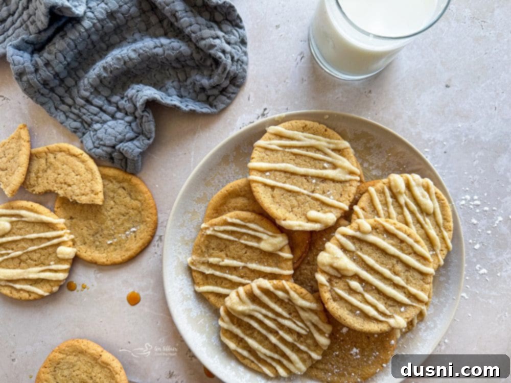 Several Iced Maple Sugar Cookies arranged on a white serving plate