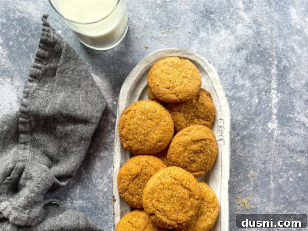 Chewy Brown Sugar Delights 13 A close-up of a stack of freshly baked brown sugar cookies, showing their perfect golden-brown color and soft texture.