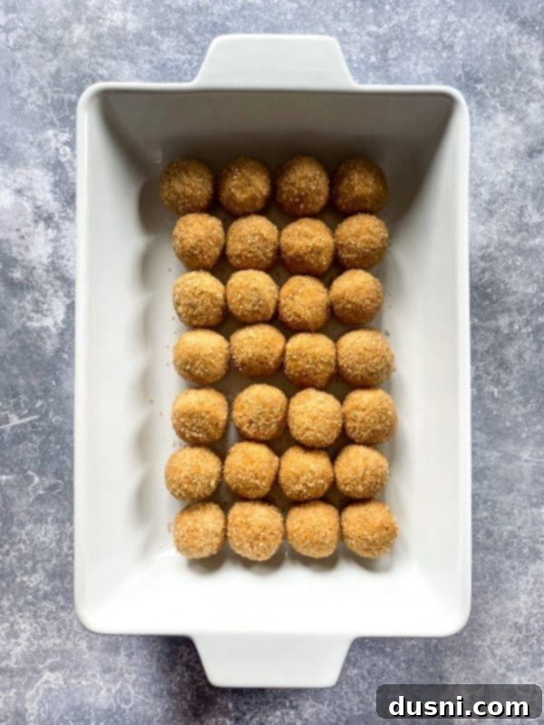 Chewy Brown Sugar Delights 8 Cookie dough balls scooped out onto a baking sheet, ready for the next step.