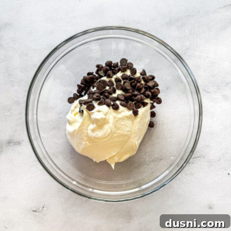 Hot Cocoa Thumbprint Delights 11 Melting Cool Whip and chocolate for the ganache filling.