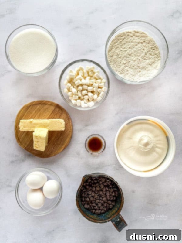 Hot Cocoa Thumbprint Delights 4 A close-up shot of a single Hot Chocolate Thumbprint Cookie, showing the crisp cookie edge, molten chocolate center, and soft marshmallow topping.