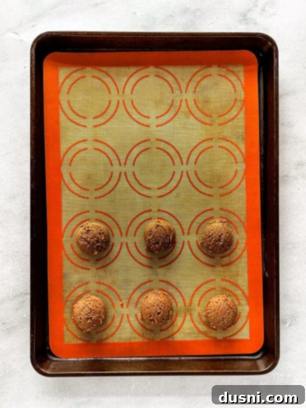 Hot Cocoa Thumbprint Delights 8 Rolling cookie dough into small balls ready for baking.