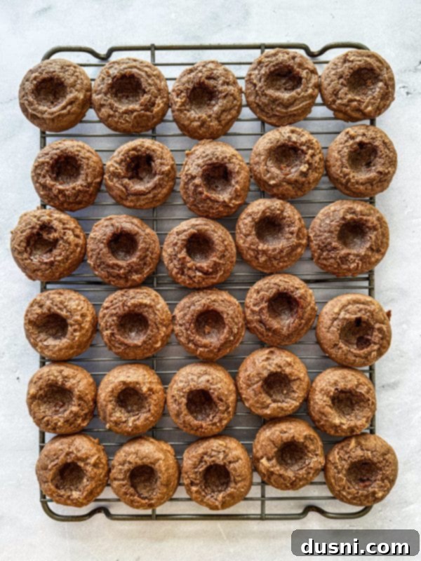 Hot Cocoa Thumbprint Delights 10 Transferring baked thumbprint cookies to a cooling rack.