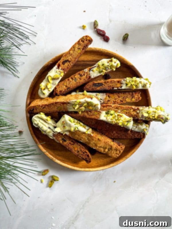 Cooled biscotti pieces on a wire rack.