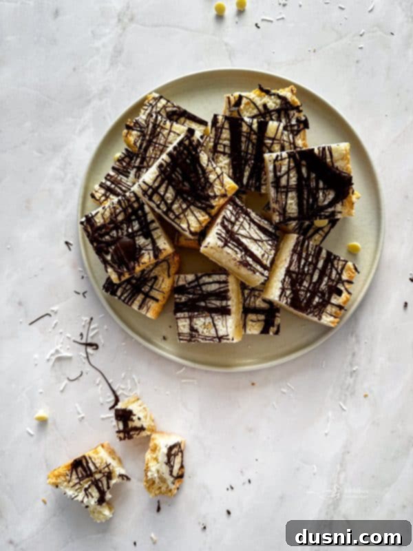 Decadent Coconut Macaroon Blondies 2 Close-up of a Coconut Macaroon Blondie on a plate